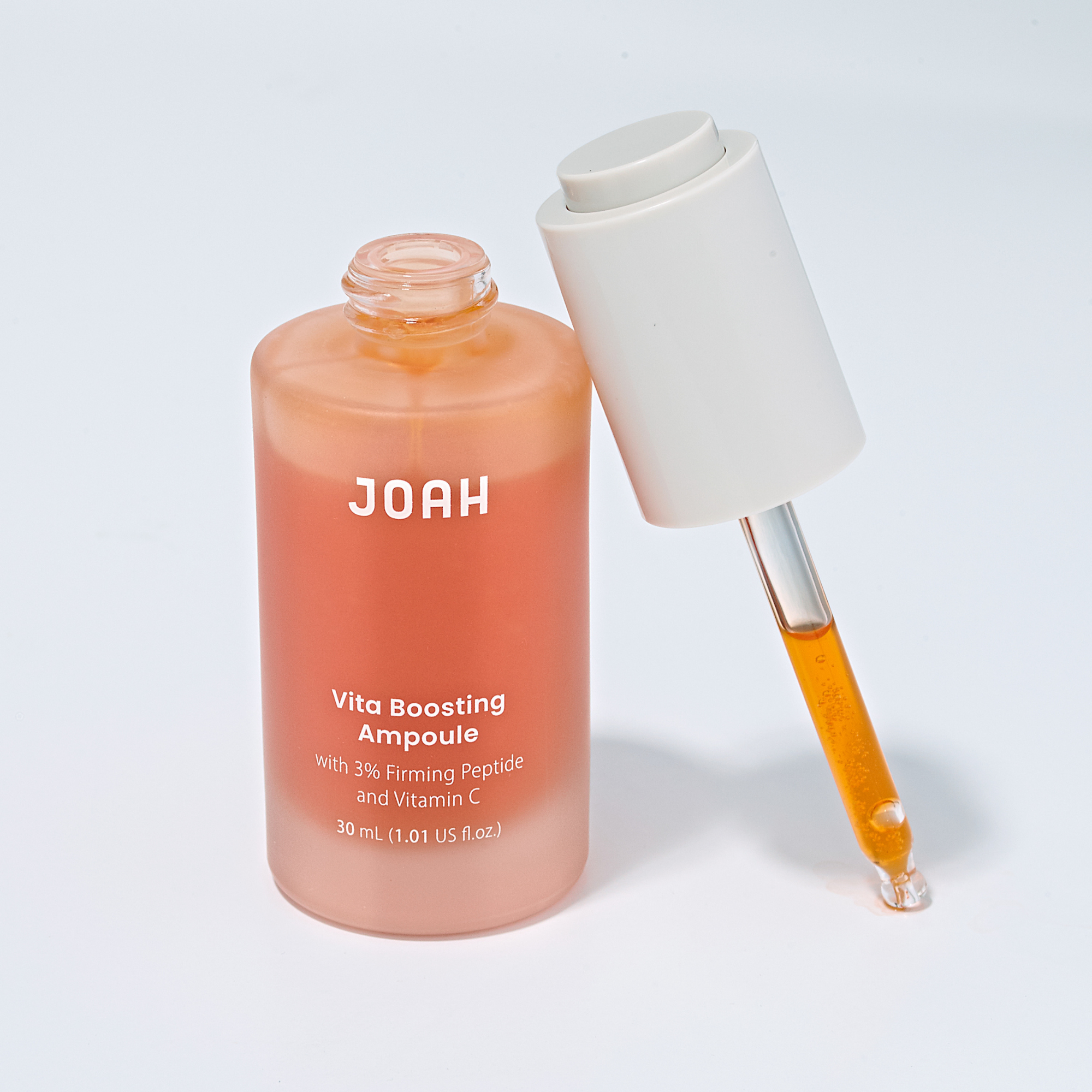 JOAH Vita Boosting Ampoule bottle with dropper on a light gray background
