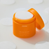 Orange container of JOAH product with white pads on a light background